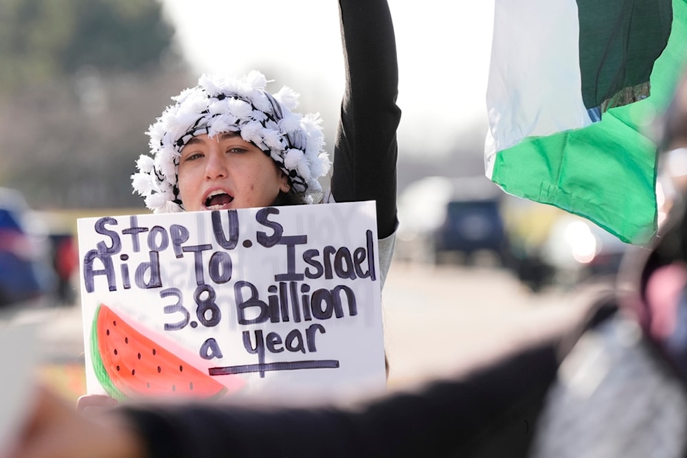 Amana Ali joins about three dozen people protesting Israel's attacks in Gaza, Thursday, Feb. 8, 2024 in Dearborn, Mich. (AP)
