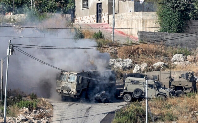 Israeli armored vehicle during an IOF raid in Jenin in the West Bank on June 19, 2023. (AFP)