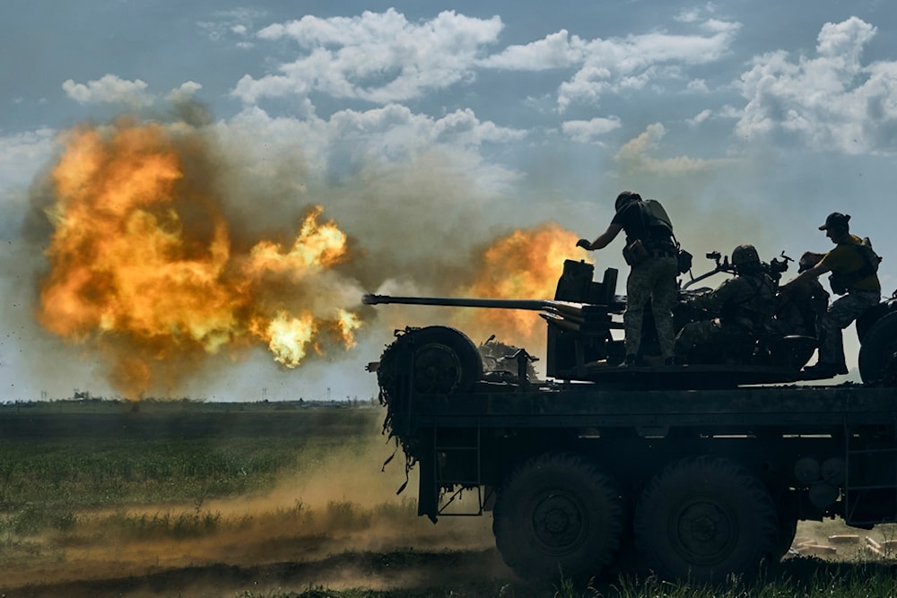 Ukrainian soldiers fire a cannon near the eastern city of Bakhmut in the Donetsk region of Ukraine, Monday, May 15, 2023 (AP)