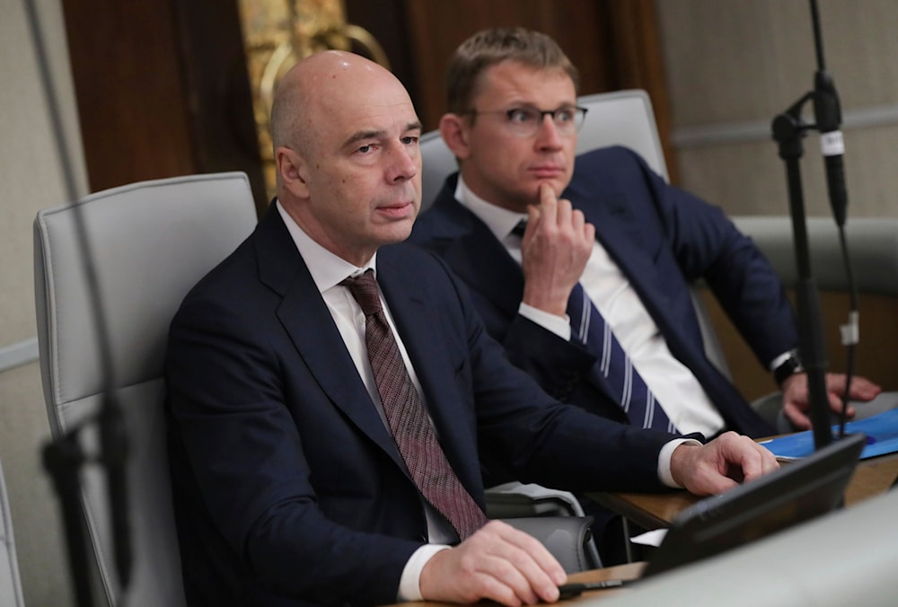 Russia's Finance Minister Anton Siluanov, left, attends a session at the State Duma, the Lower House of the Russian Parliament in Moscow, Russia, on Friday, Nov. 17, 2023. (AP)