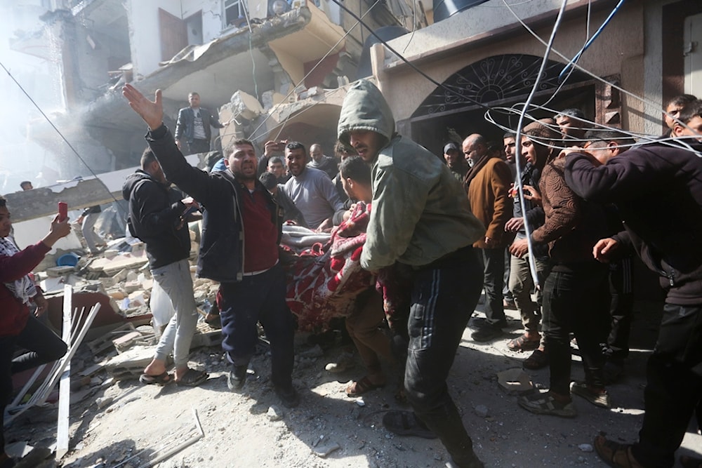 Palestinian citizens rescue survivors after an Israeli strike on Shaheen family house in Rafah, Gaza Strip, Saturday, Feb. 24, 2024. (AP Photo/Hatem Ali)