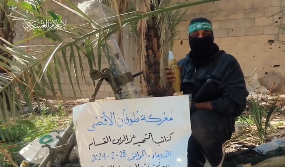 An Al-Qassam freedom fighter holding a mortar shell to be used against IOF gatherings, on February 28, 2024 (Military Media)