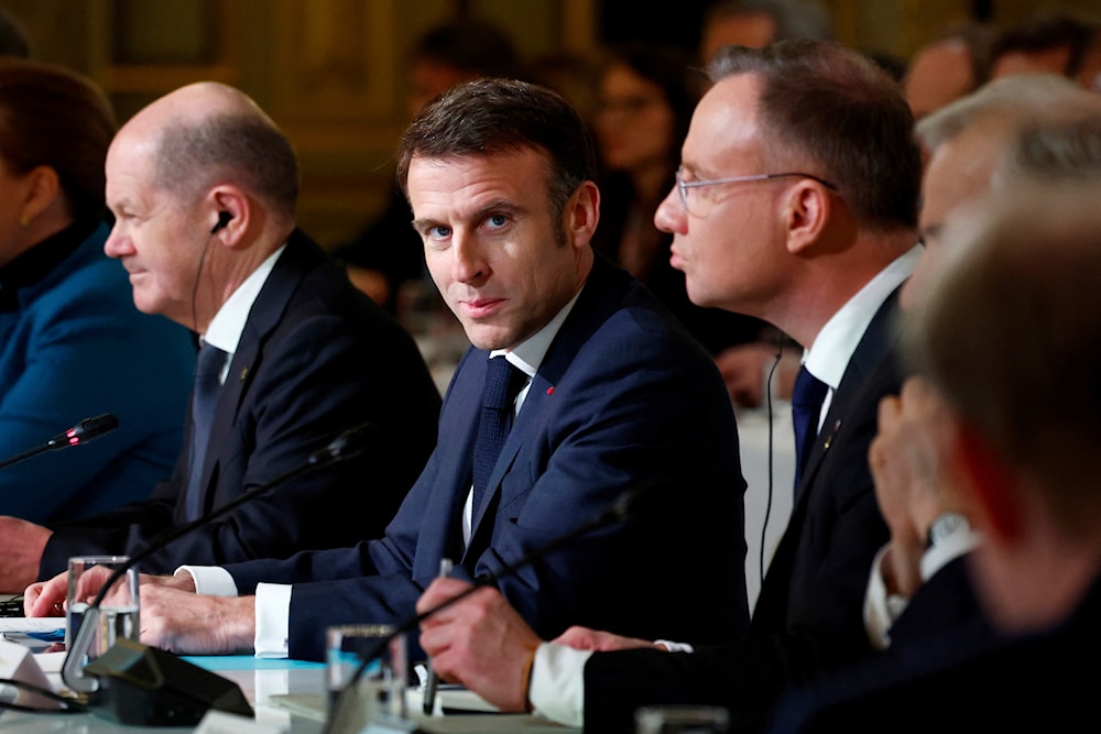 French President Emmanuel Macron, center, delivers a speech at the Elysee Palace in Paris, Monday, Feb. 26, 2024. (AP)