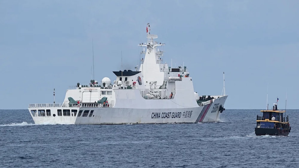 This photo taken on August 22, 2023 shows a Chinese coast guard ship (L) in the South China Sea (AFP/Getty Images)