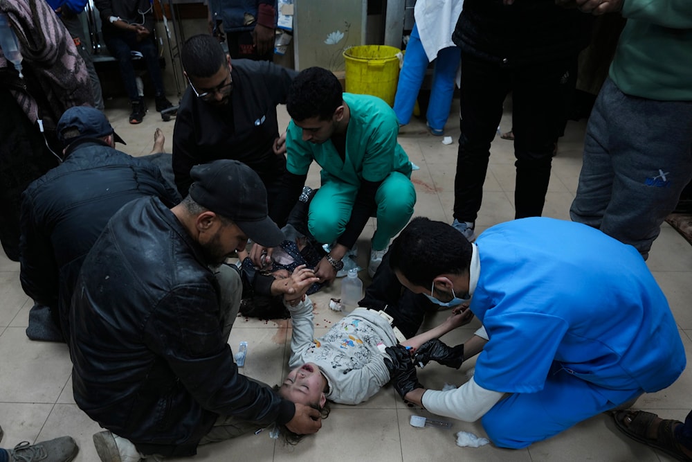 Palestinians wounded by the Israeli bombardment of the Gaza Strip are brought to Al-Aqsa Hospital in Deir al-Balah, on Friday, Feb. 23, 2024. (AP)