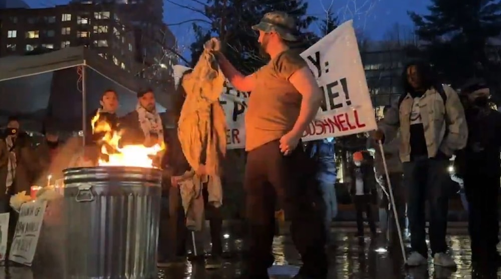 At a vigil honoring Aaron Bushnell in Oregon, US veterans were seen burning their military uniforms in a tribute to the former US airman and in rejection of US complicity in the Israeli genocide in Gaza. (Screen grab, social media)