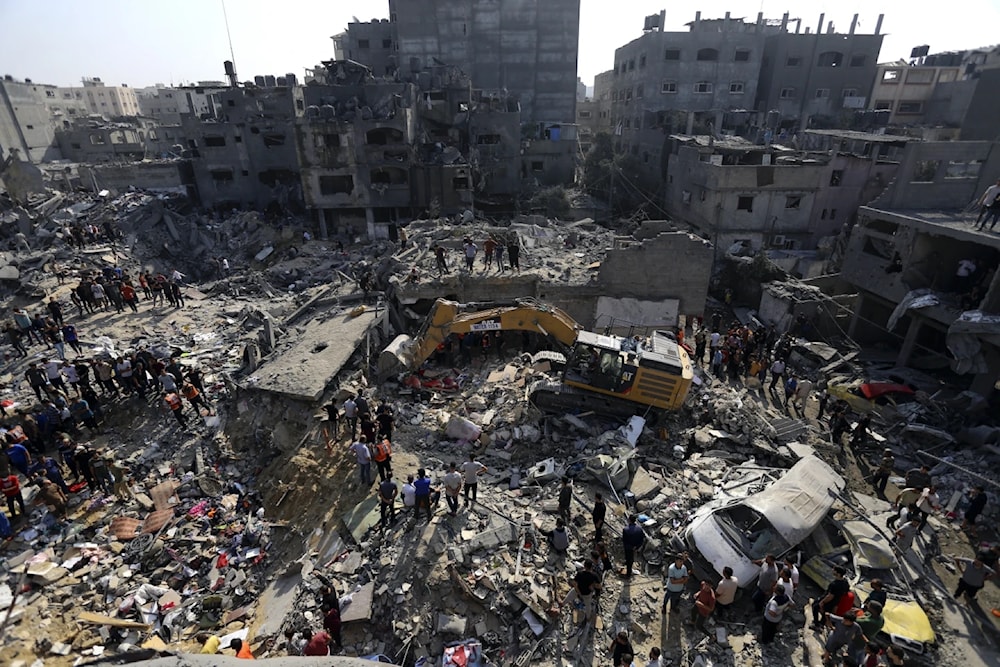 Palestinians look for their family members and neighbors under the rubble of a destroyed residential building following an Israeli airstrike in Jabaliya refugee camp on November 1, 2023. (AP)