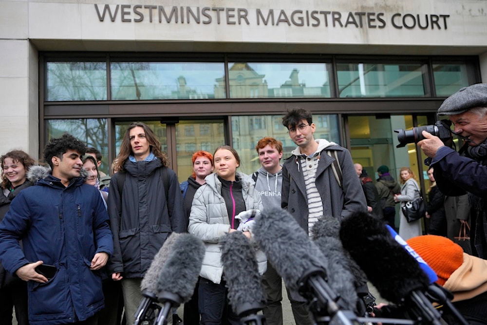Environmental activist Greta Thunberg, centre, speaks to the media at Westminster Magistrates Court in London, Friday, Feb. 2, 2024. (AP)