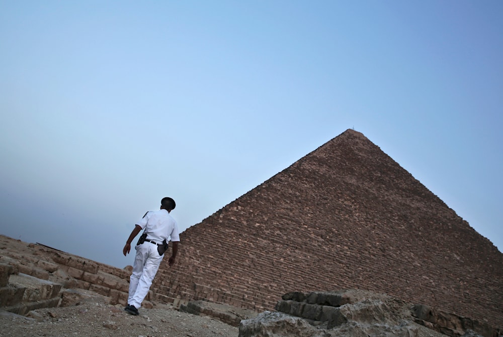  An Egyptian policeman walks near a pyramid in Giza, Egypt, on Nov. 9, 2015. (AP)