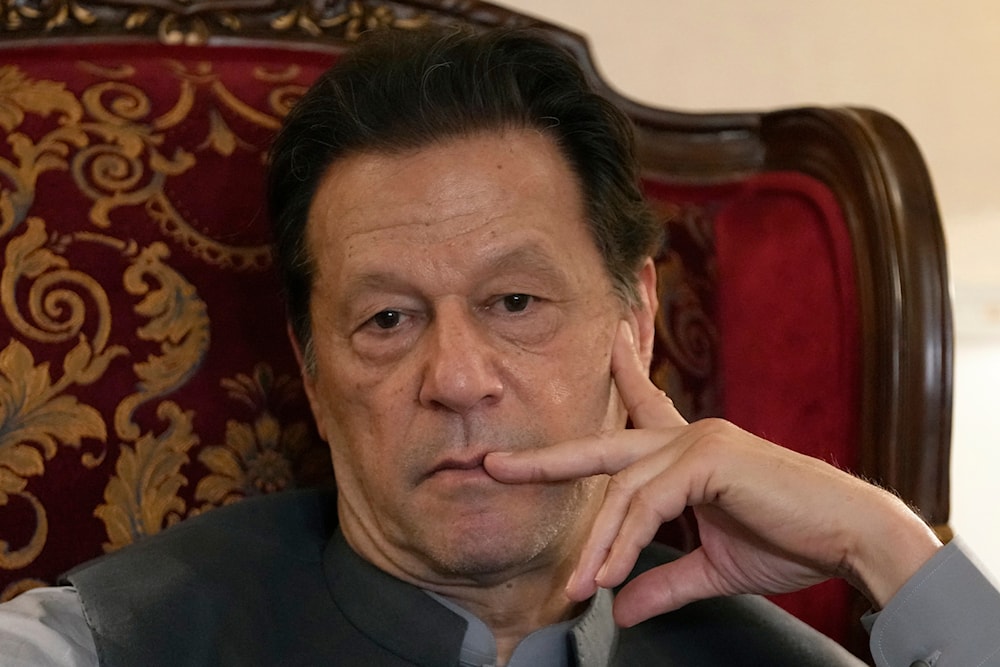 Pakistan's former Prime Minister Imran Khan listens to a member of the media during a talk with reporters regarding the current political situation and the ongoing cases against him at his residence in Lahore, Pakistan, on Aug. 3, 2023(AP)