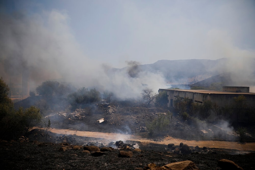 Fields burn following a hit by a rocket fired from Lebanon near the northern settlement of 