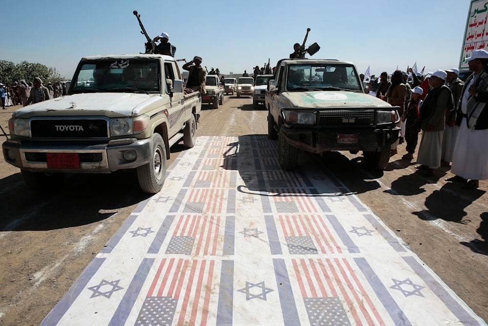 Ansar Allah fighters stage a rally against the U.S. government and against the US-led sustained airstrikes on Yemen, near Sanaa, Yemen, January 25, 2024 (AP)