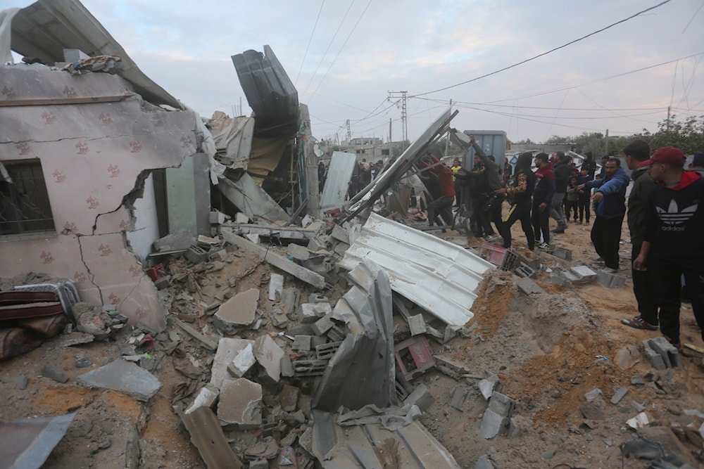 Palestinians look at a residential house destroyed in an Israeli strike in Rafah, Gaza Strip, Monday, Feb. 5, 2024.(AP)