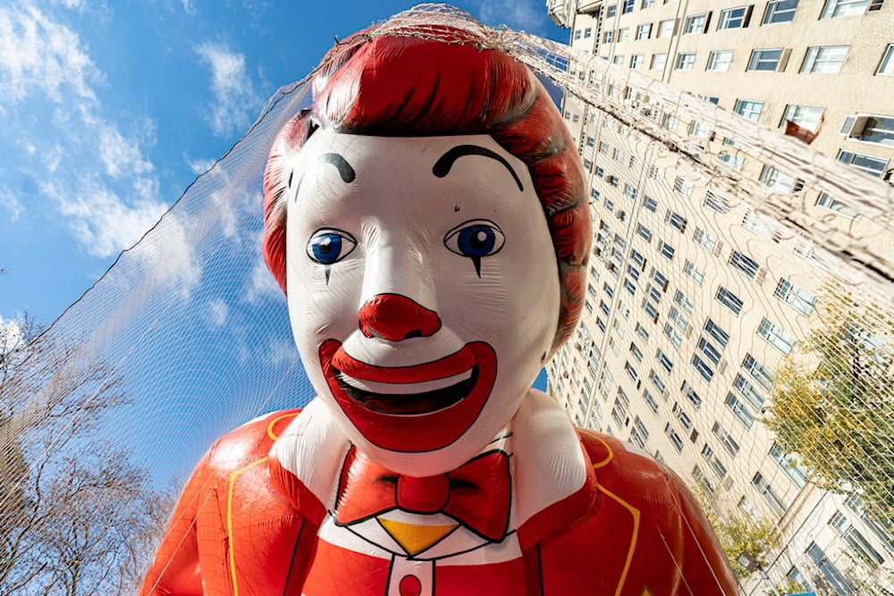 The Ronald McDonald balloon floats above the road during the balloon inflation for the 97th Macy's Thanksgiving Day Parade in New York, Wednesday, Nov. 22, 2023. (AP Photo/Peter K. Afriyie)