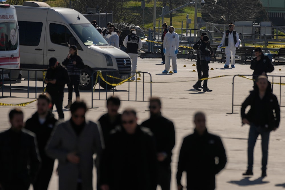 Security officers check the site where two attackers were killed outside a courthouse in Istanbul, Turkey, Tuesday, Feb. 6, 2024. (AP)