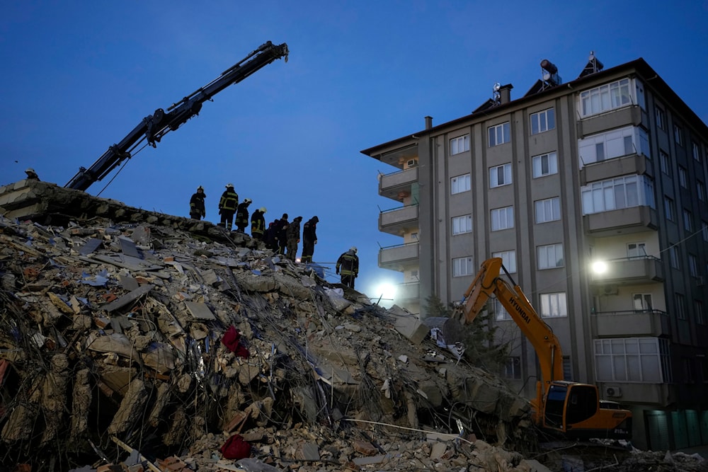 Firefighters search for people in the rubble of a destroyed building, in Gaziantep, southeastern Turkey, Wednesday, Feb. 8, 2023. (AP)