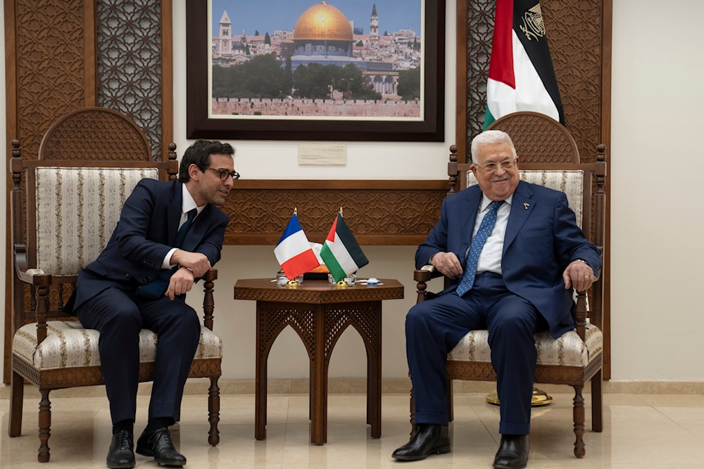 Palestinian President Mahmoud Abbas, right, receives French foreign minister Stéphane Séjourné at his office in Ramallah, Monday, Feb. 5, 2024. (AP)