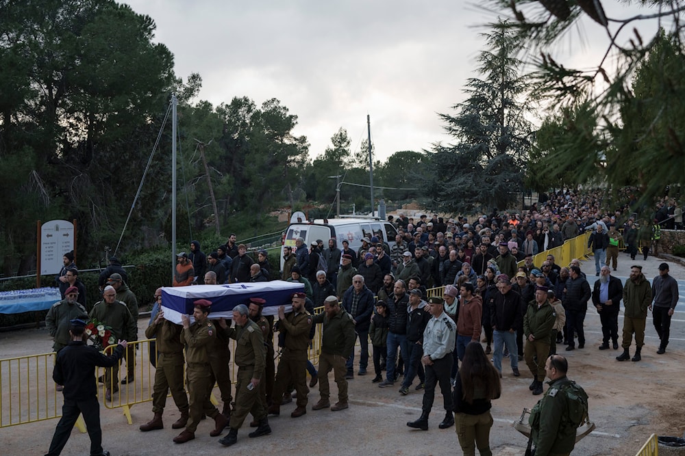 Israeli soldiers carry the flag-draped casket of reservist warrant officer Yuval Nir during his funeral at a cemetery in the West Bank settlement of Kfar Etzion, Israel, Wednesday, Jan. 31, 2024. (AP)