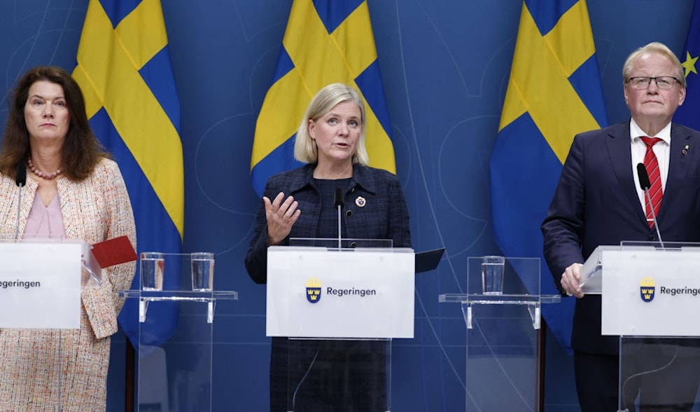 Sweden's foreign minister, prime minister and defense minister hold a press conference in Stockholm on the gas leak found on the Nord Stream 1 pipeline in the Baltic Sea on Sept. 27, 2022. (AFP)