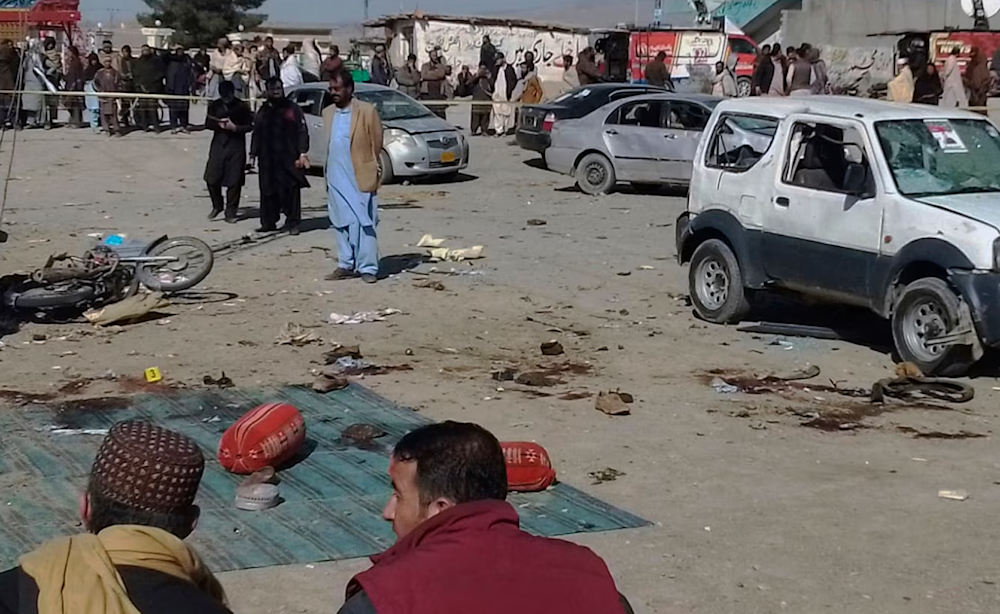 Security officials examine the scene of a bomb blast in Pakistan's Balochistan Province on February 7.