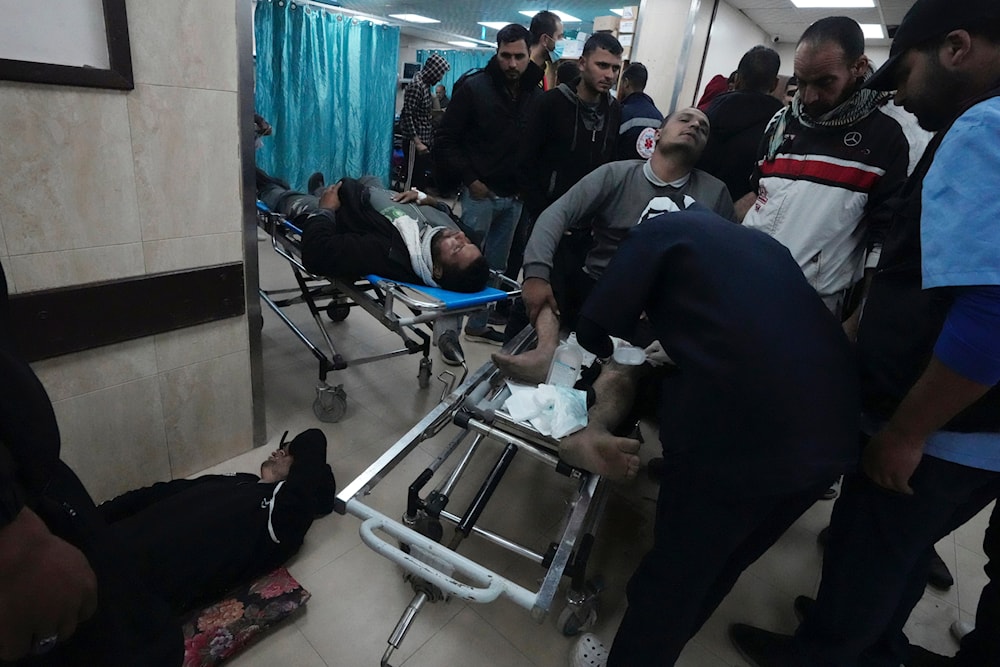Palestinians wounded in the Israeli air and ground offensive on the Gaza Strip are brought to a hospital in Deir al Balah on Friday, Jan. 26, 2024. (AP)
