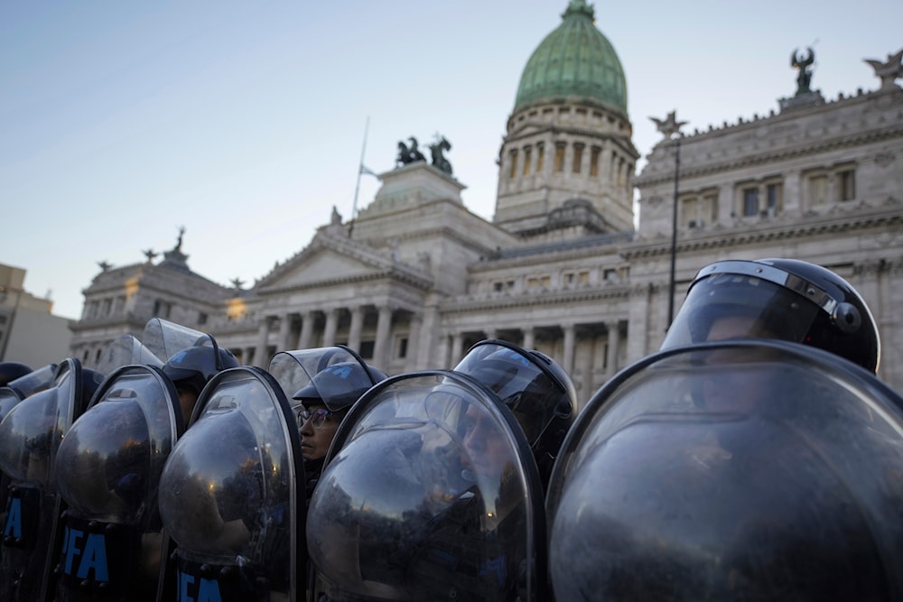 Police guard Congress after a bill promoted by Argentine President Javier Milei was approved in general by the lower house of Congress, in Buenos Aires, Argentina, Friday, Feb. 2, 2024. (AP)