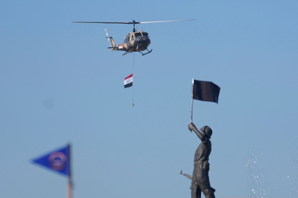 An Iraqi Army helicopter is seen during the Army Day celebrations in Baghdad, Iraq, Saturday, Jan. 6, 2024. The Iraqi Army was activated on Jan. 6, 1921, while under British rule. (AP Photo)