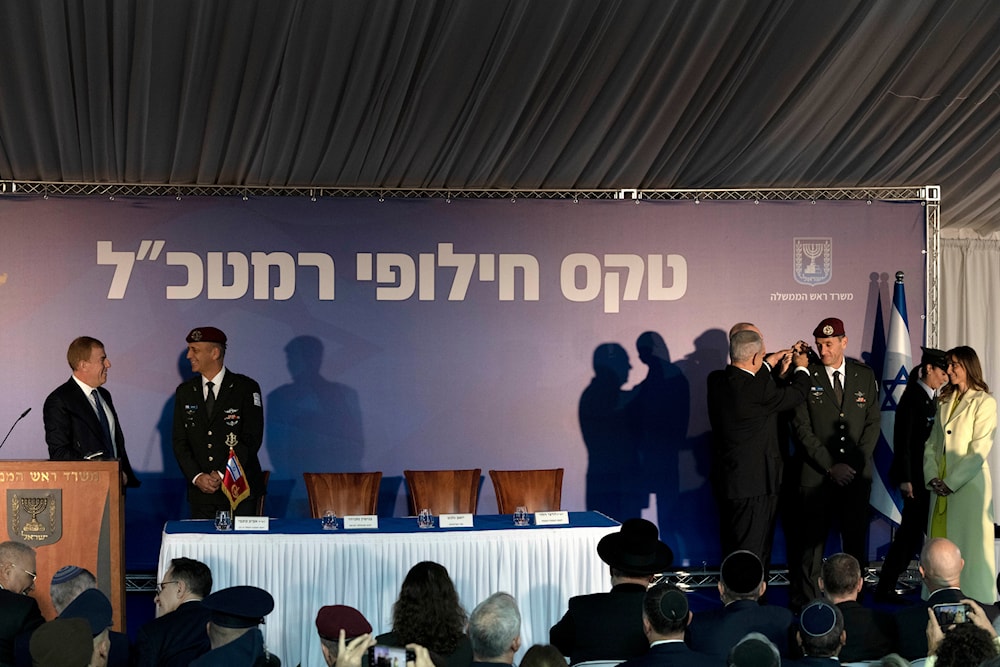 Sharon Halevi watches as Benjamin Netanyahu, promotes her husband, the new IOF Chief to the rank of Lieutenant-General as outgoing chief Aviv Kochavi, chats on the stage in occupied al-Quds, Monday, Jan. 16, 2023(AP)