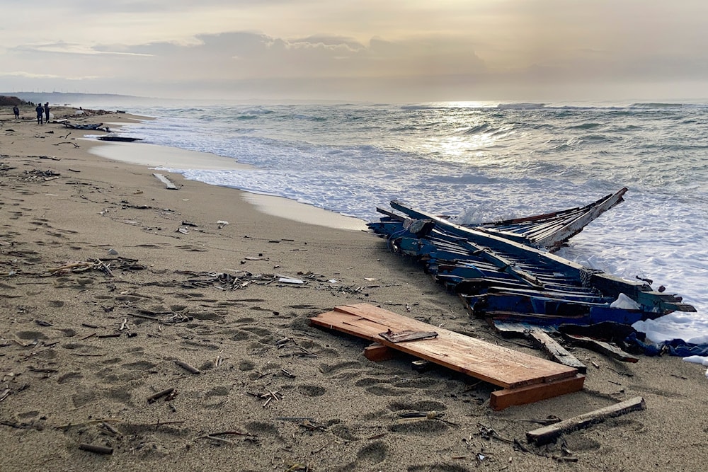 A view of part of the wreckage of a capsized boat that was washed ashore at a beach near Cutro, southern Italy, on Feb. 27, 2023(AP)