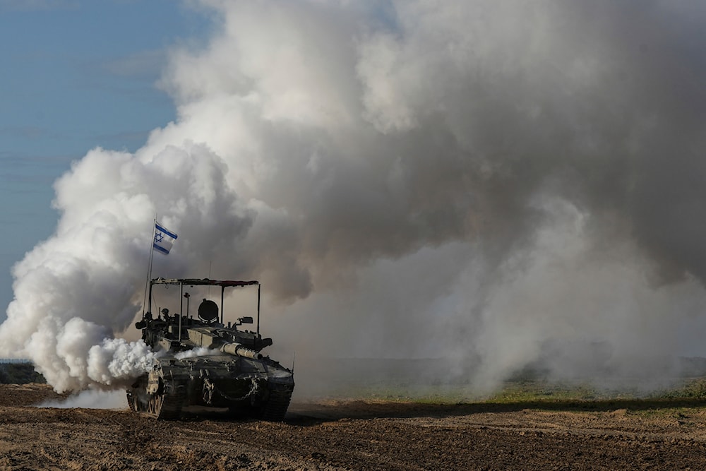 An Israeli army tank moves near the Gaza Strip, in southern occupied Palestine, Wednesday, Jan. 24, 2024 (AP)