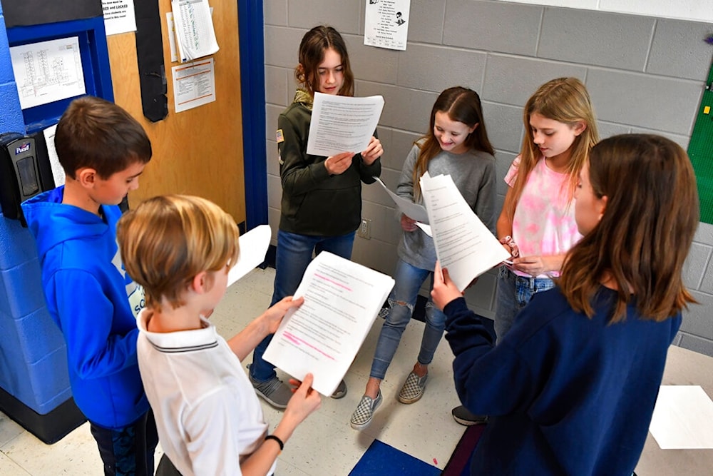 Students rehearse their lines of a three-scene play written by ChatGPT in Donnie Piercey's class at Stonewall Elementary in Lexington, Ky., Monday, Feb. 6, 2023. 