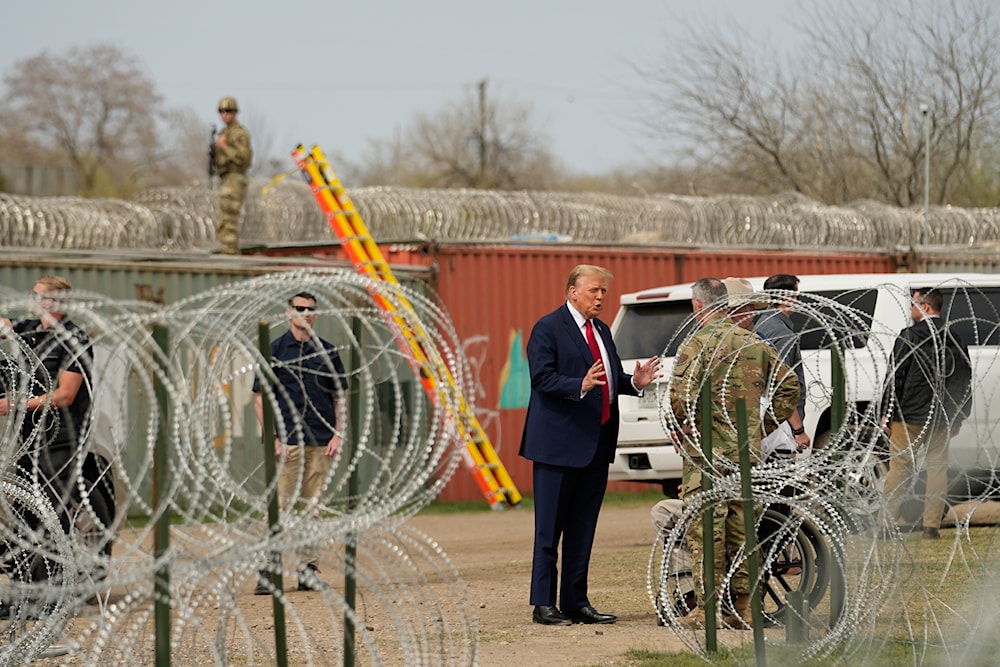 Republican presidential candidate former President Donald Trump talks with Maj. Gen. Thomas Suelzer, Adjutant General for the State of Texas, during a visit to the US-Mexico border in Texas. (AP)