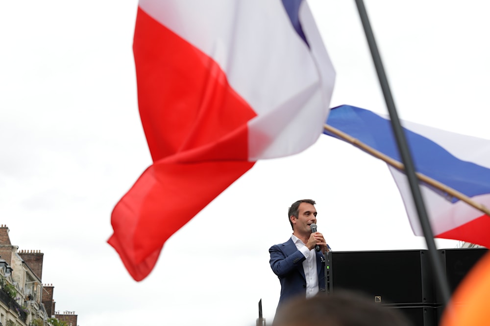 Far-right Florian Philippot addresses the crowd during a rally against the health pass, on Saturday, Aug. 21, 2021, in Paris.(AP)