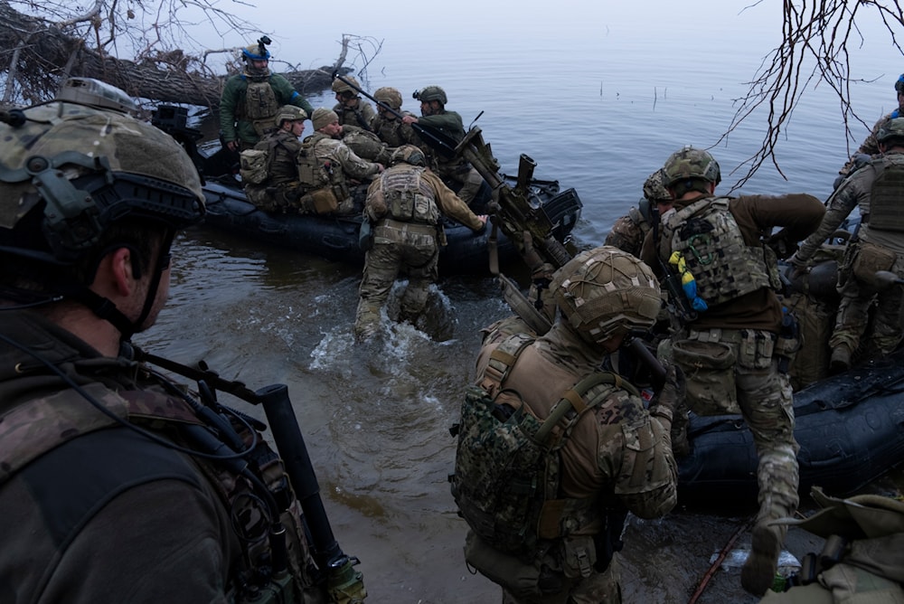 Ukrainian troops board a boat on the shore of Dnieper River near Kherson on Sunday Oct. 15, 2023.  (AP)