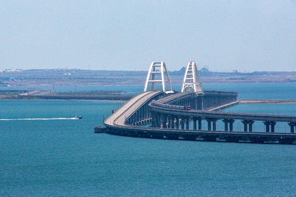 A freight train runs on rails of a railway link of the Crimean Bridge connecting the Russian mainland and the Crimean peninsula over the Kerch Strait not far from Kerch, Crimea, on Monday, July 17, 2023. (AP)