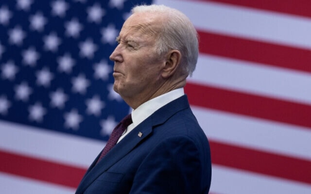 US President Joe Biden looks on before speaking about the costs of living during an address at the YMCA Allard Center March 11, 2024, in Goffstown, New Hampshire. (AFP)