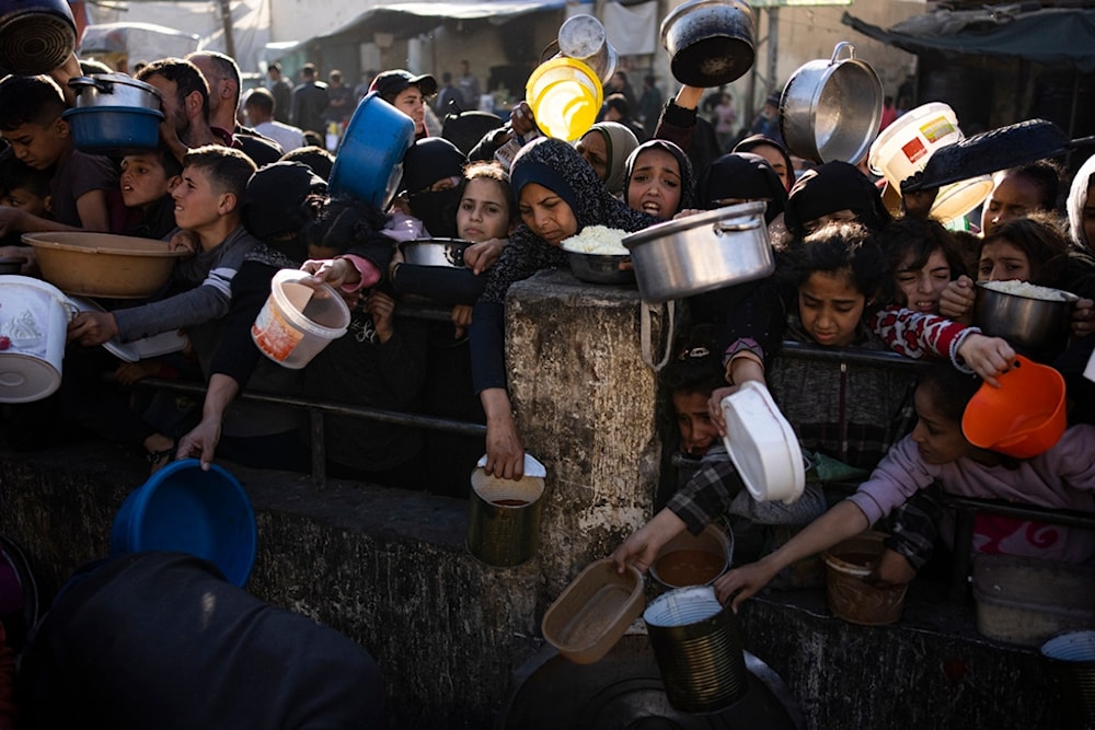 Palestinians line up for food in Rafah, Gaza Strip, on Tuesday, March 12, 2024. (AP)