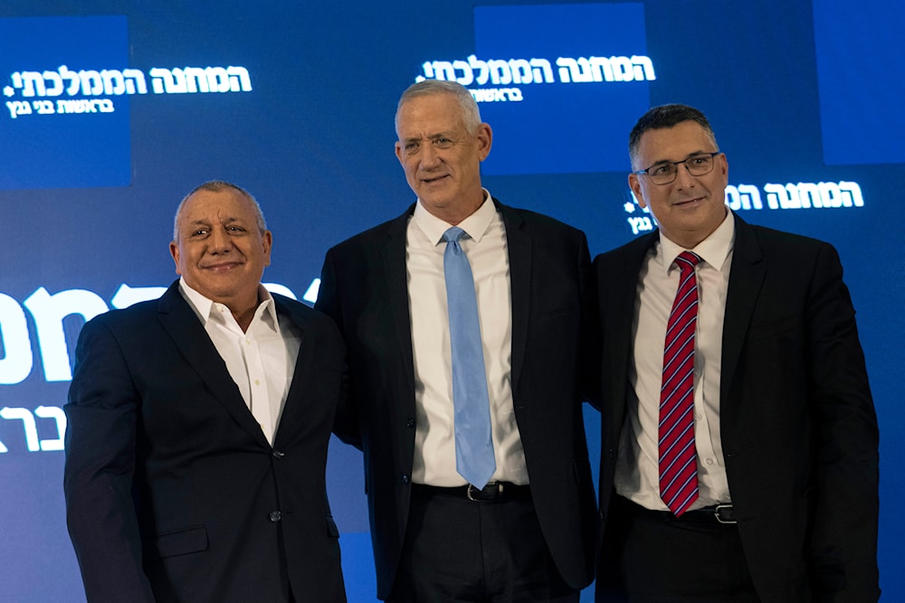 Former IOF chief Gadi Eisenkot, left, Benny Gantz, center, and Gideon Sa'ar pose together in 'Ramat Gan', occupied Palestine, August 14, 2022 (AP)