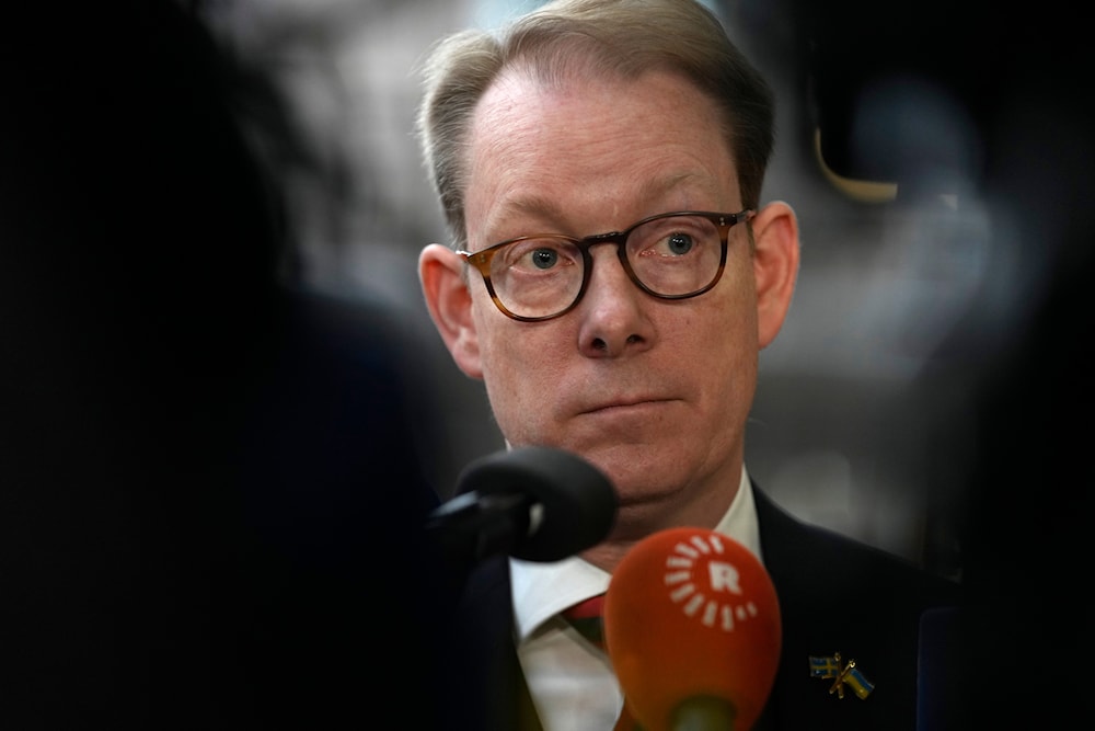 Sweden's Foreign Minister Tobias Billstrom speaks with the media as he arrives for a meeting of EU foreign ministers at the European Council building in Brussels, Monday, Jan. 22, 2024. (AP)