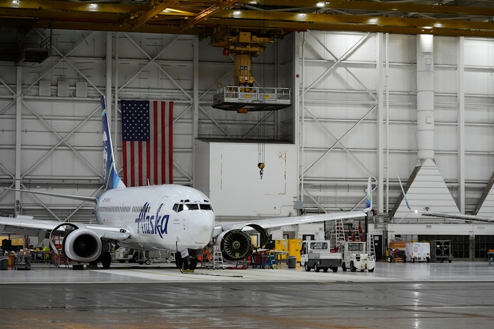 An Alaska Airlines aircraft sits in the airline's hangar at Seattle-Tacoma International Airport Wednesday, Jan. 10, 2024, in SeaTac, Wash. (AP Photo/Lindsey Wasson)