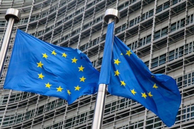 European Union flags fly outside the headquarters of the European Commission in Brussels. (AFP)