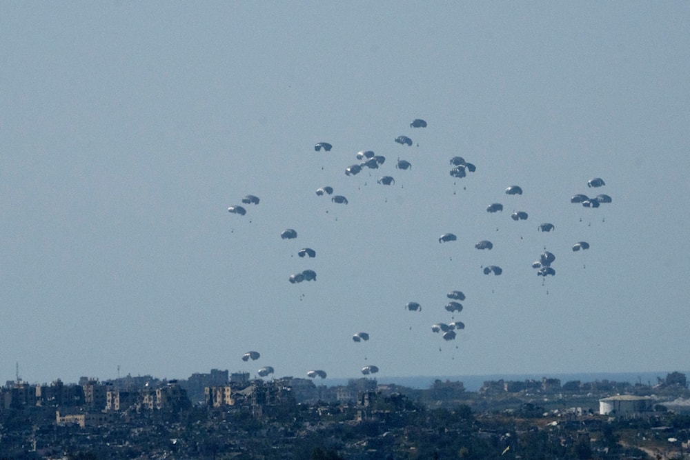 Parachutes drop humanitarian aid into the northern Gaza Strip on March 11, 2024. (AP)