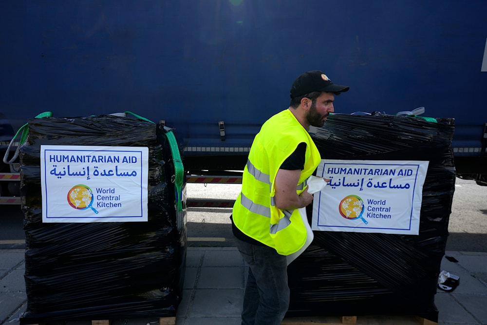 A member of the World Central Kitchen prepares a pallet with the humanitarian aid at a warehouse near Larnaca, Cyprus, on Wednesday, March 13, 2024 (AP)