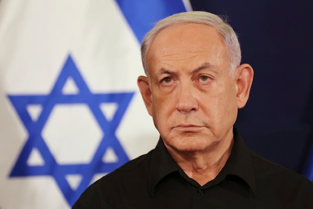 Israeli Prime Minister Benjamin Netanyahu attends a press conference with Defense Minister Yoav Gallant and Cabinet Minister Benny Gantz in 'Tel Aviv', occupied Palestine, Oct. 28, 2023. (AP)