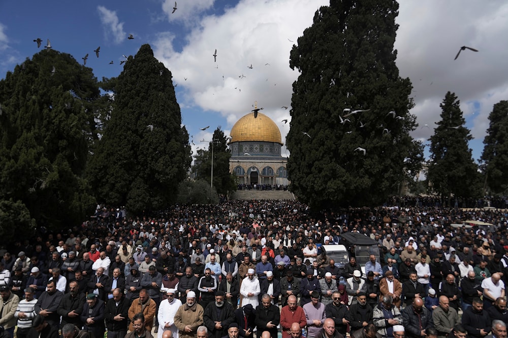 Muslim worshippers perform Jummuah, or Friday, prayers at the al-Aqsa Mosque compound in the Old City of al-Quds during the holy month of Ramadan, March 15, 2024 (AP)