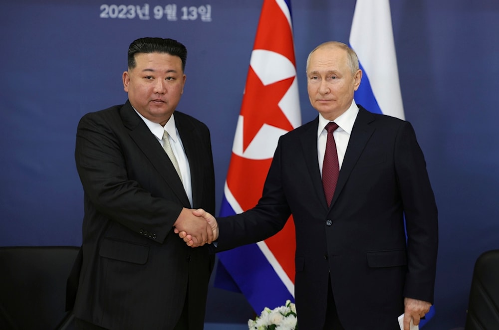 Russian President Vladimir Putin, right, and North Korea's leader Kim Jong Un shake hands during their meeting at the Vostochny cosmodrome on Sept. 13, 2023 (AP)