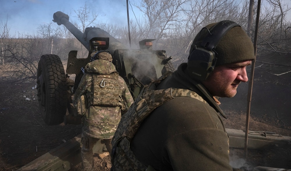 Ukrainian soldiers of 80th separate airborne assault brigade fires a D-30 cannon towards Russian positions at the front line, near Klishchiivka, Donetsk region, Ukraine, Saturday, March 2, 2024. (AP)