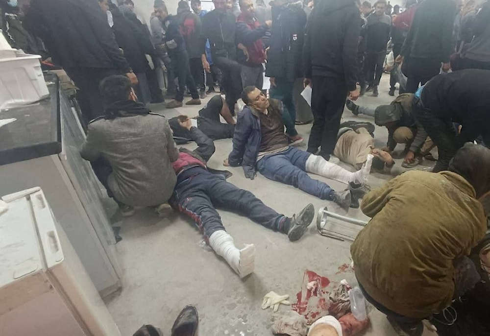 Injured and martyred Palestinians arrive at Al-Shifa hospital in Gaza following the Israeli massacre near the Kuwait Roundabout on March 14, 2024 (Social Media)