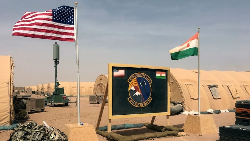  US and Niger flags are raised side by side at the base camp for air forces and other personnel supporting the construction of Niger Air Base 201 in Agadez, Niger in April 2018. (AP)
