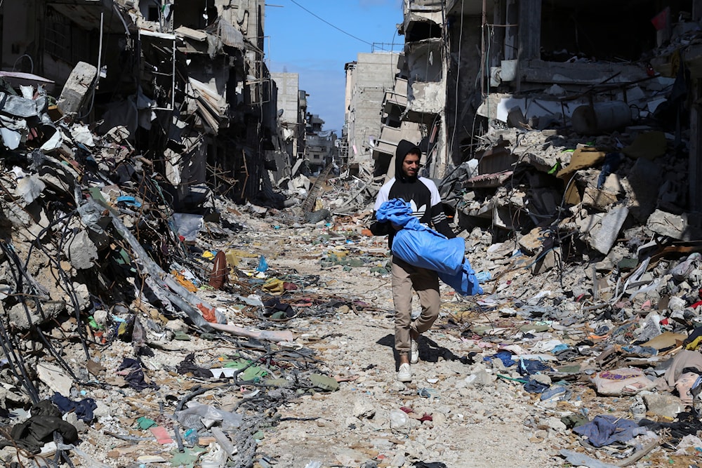 A Palestinian walks through the destruction left by the Israeli offensive on Khan Younis, Gaza Strip, Friday, March 8, 2024.(AP)